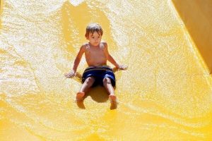 Child on a water slide
